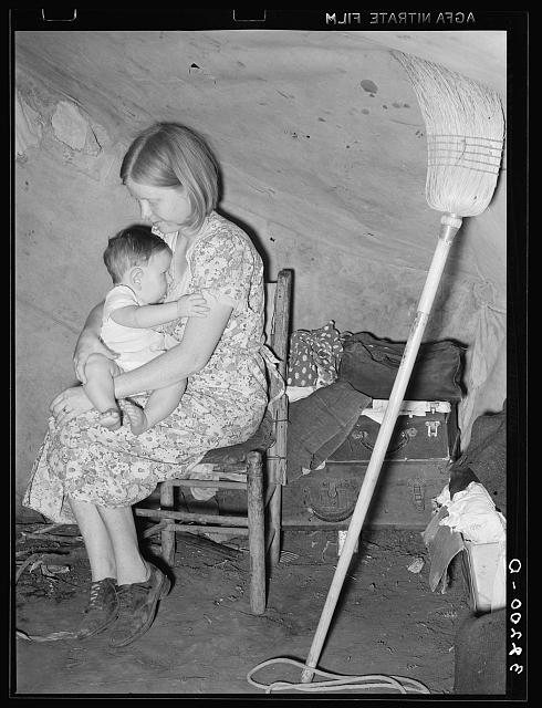 Migrant mother and child in tent home. Harlingen, Texas; Lee, Russell, 1903-1986, photographer; LC-USF34- 032200-D