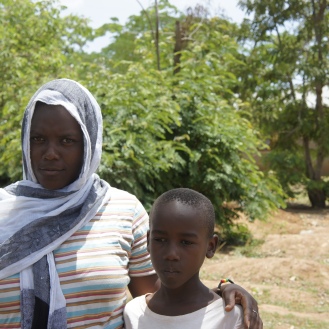 Brother and sister at male circumcision appointment in Tanzania