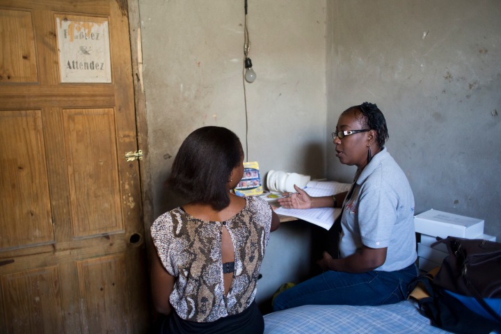 Roselaure Isidor provides counseling to a commercial sex workers at a brothel.