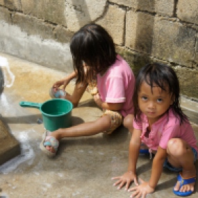 Girls in the Philippines playing in water